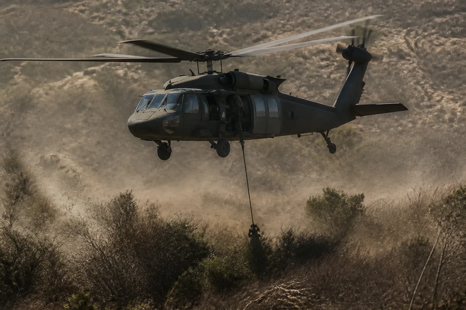 A rescue helicopter hovering low over scrubland with a hoist cable lowered, vegetation blown flat beneath it (AI-generated image)